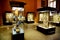 Museum exhibits of ancient relics in glass cases