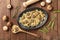 Mushroom and cheese pasta. Farfalle with cremini and green peas, shot from above