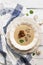 Mushroom cream soup with rye croutons on a white wooden table. Top view, flat lay