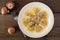 Mushroom filled ravioli pasta, above view over wood