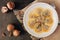 Mushroom filled ravioli pasta, overhead scene on stone background