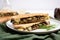 mushroom and gouda cheese panini sliced on a plate