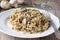 Mushroom risotto with grated cheese on white plate