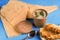 Mushroom soup in paper disposable cup for take away and food delivery with homemade bread on blue background