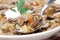 Mushroom soup with pearl barley in a spoon