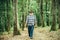 Mushrooming in forest, Grandfather hunting mushrooms over summer forest background.