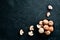 Mushrooms on a black stone background. Champignons Top view.