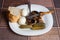 Mushrooms,boiled eggs and cucumber in a white plate on table