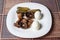 Mushrooms,boiled eggs and cucumber in a white plate on table