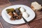 Mushrooms,boiled eggs and cucumber in a white plate on table