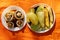 Mushrooms, eggplant and zucchini fried on the grill lie on plates in the summer at a picnic on a twist in the forest, lunch in