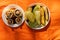 Mushrooms, eggplant and zucchini fried on the grill lie on plates in the summer at a picnic on a twist in the forest, lunch in