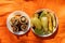 Mushrooms, eggplant and zucchini fried on the grill lie on plates in the summer at a picnic on a twist in the forest, lunch in