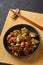 Mushrooms Manchurian dry in black bowl at dark slate background