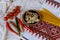 Mushrooms pickled, red tomatoes and hoot pepper in a ukrainian embroidered towel style selective Focus