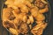 Mushrooms on plate. Pickled mushrooms in a plate. On wooden background