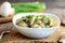 Mushrooms in a sour cream sauce. Mushrooms stew with sour cream and fresh green onions in a bowl. Healthy vegan recipe