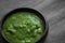 Mushy peas in a wooden bowl