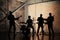 Music band and fashion. Handsome young men in suits playing rock and singing song. Bands silhouettes with on a concert.