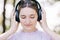 Music Bliss: Woman with Headphones in Nature