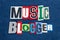 MUSIC BLOGGER text word collage colorful fabric on blue denim, music industry blogs and blogging