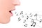 Music concept - close up of female mouth singing over white