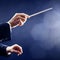 Music conductor hands orchestra