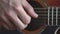 Music, creativity, concert, self-isolation concept. Close-up hands of young man playing an acoustic guitar dreadnought
