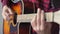 Music, creativity, concert, self-isolation concept. Close-up hands of young man playing an acoustic guitar dreadnought