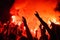 Music fans burn fire torch on wild rock concert