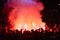 Music fans burn fire torch on wild rock concert