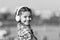 Music gives her great pleasure. Cute child with wireless headset. Small child wearing stereo headphones. Little child