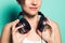 Music headphones on a girl`s neck.Woman with music helmets