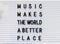 Music makes the world a better place concept made by plastic letters on a white board.