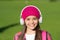 Music makes you smarter. Happy girl listen to music sunny outdoors. Little kid wear headphones playing music. Summer