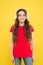 The only music that matters. Adorable girl enjoying music on yellow background. Little child listening to music in