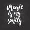 Music is my sanity - hand drawn Musical lettering phrase isolated on the black chalkboard background. Fun brush chalk