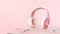 Music Online player Idea Concept and Headphones on Pink background. download and listening, Minimal, Copy space