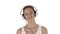 Music, people and technology concept - happy smiling woman with headphones walking on white background.