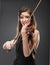 Music portrait of young woman. Violin play.