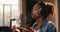 Music production. Portrait of african american lady singer recording song, singing in headphones to mic at sound record