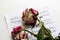 Music sheet and dead roses. The idea of the concept for love of music, for the composer, musical inspiration