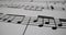 Music sheets and melodies written with musical symbols as closeup