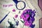 Music for the soul. the two pieces of the score notes and a bouquet of Phlox and purple and white flowers, magnifying glass, ball