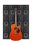 Music and sound - Orange guitar on a loudspeaker enclosure background. Isolated