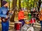 Music street performers with girl violinist on city park.