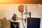 Music studio. Silver condenser microphone with pop filter