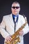 Music Themes. Portrait Of Confident Mature Male Saxophonist