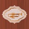 Music trumpet in frame with wooden background