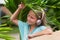 Musical cheerful mood. A little girl listens to music on headphones. Child girl in big headphones enjoys the music